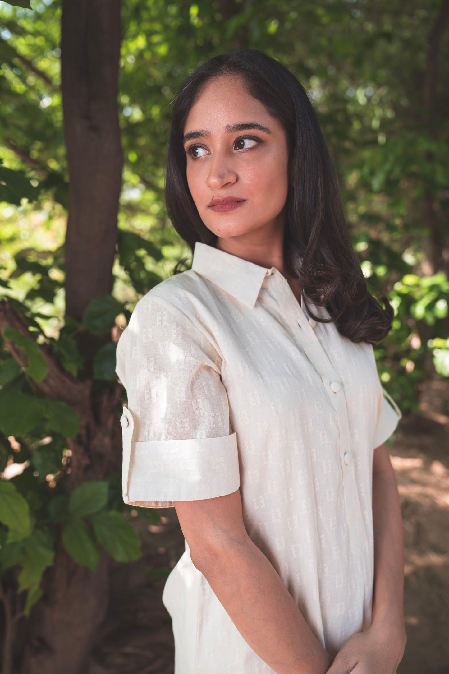 Cream Collared Kurta paired with Deer Embroidered Pants