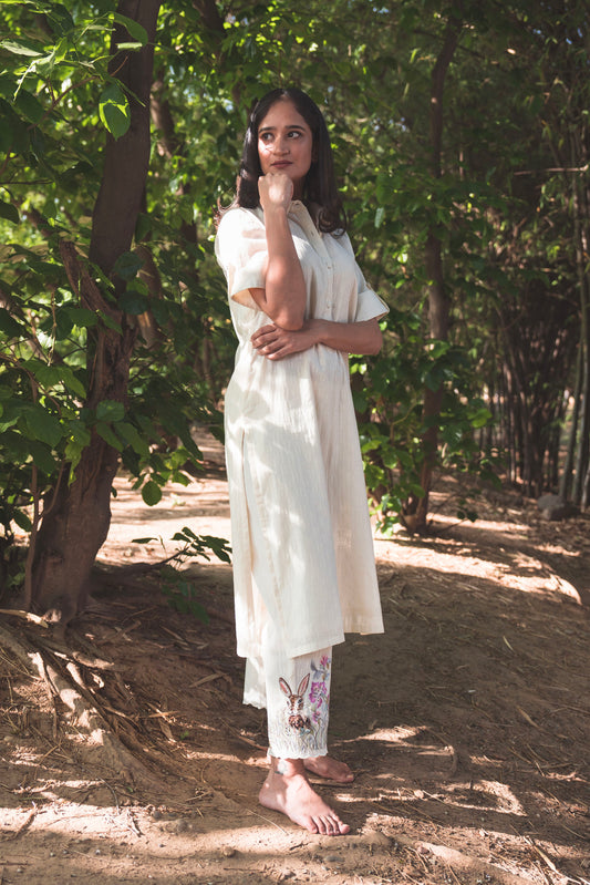 Cream Collared Kurta paired with Rabbit Embroidered Pants