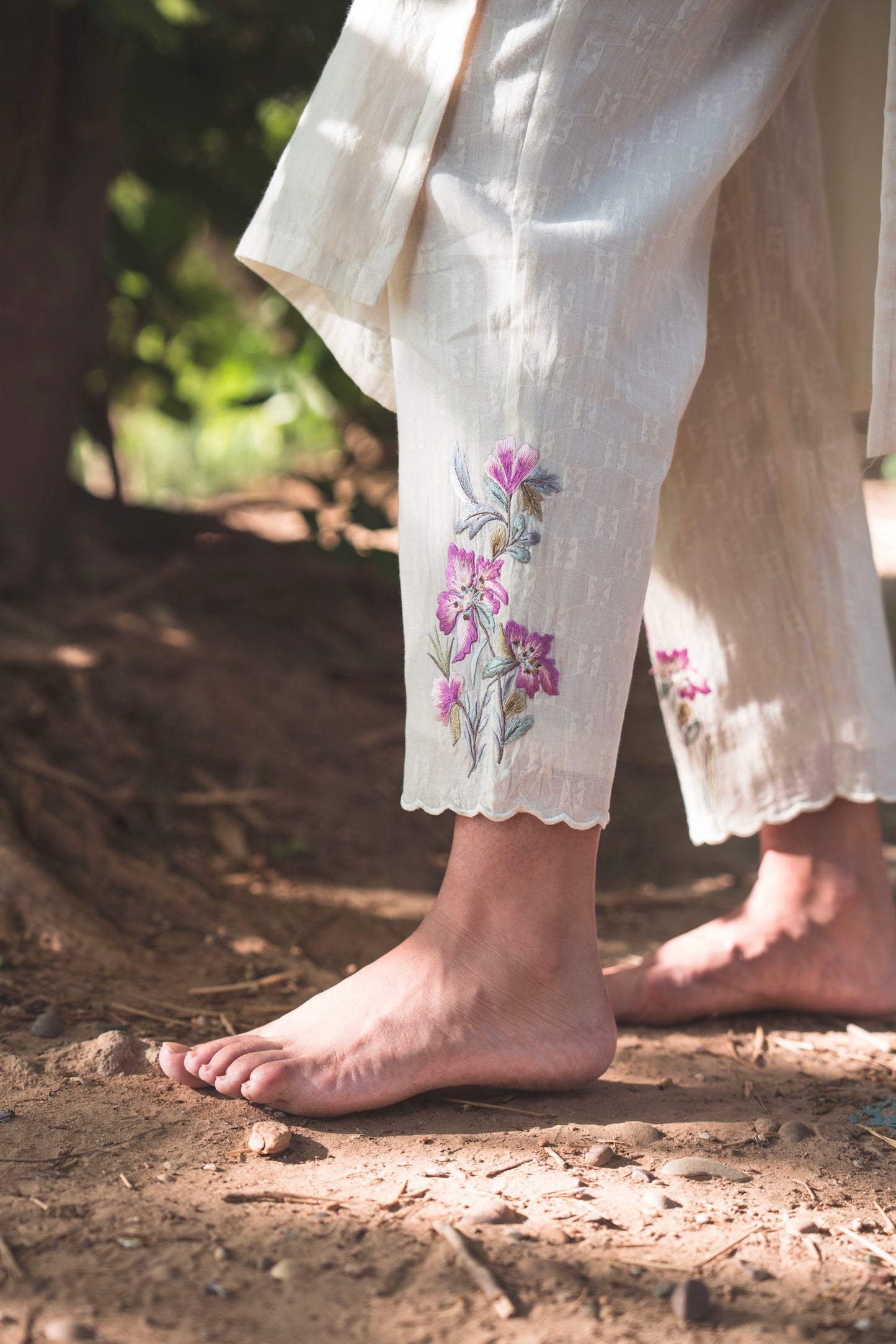 Cream Collared Kurta paired with Rabbit Embroidered Pants