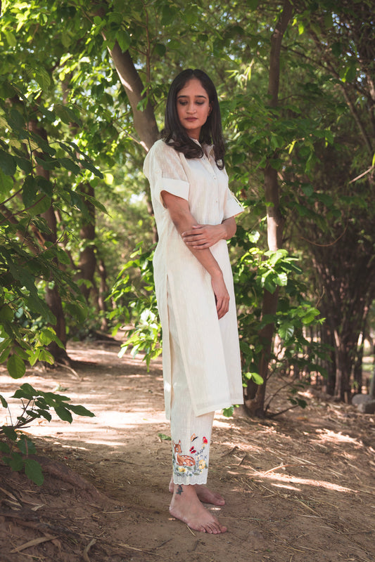 Cream Collared Kurta paired with Deer Embroidered Pants