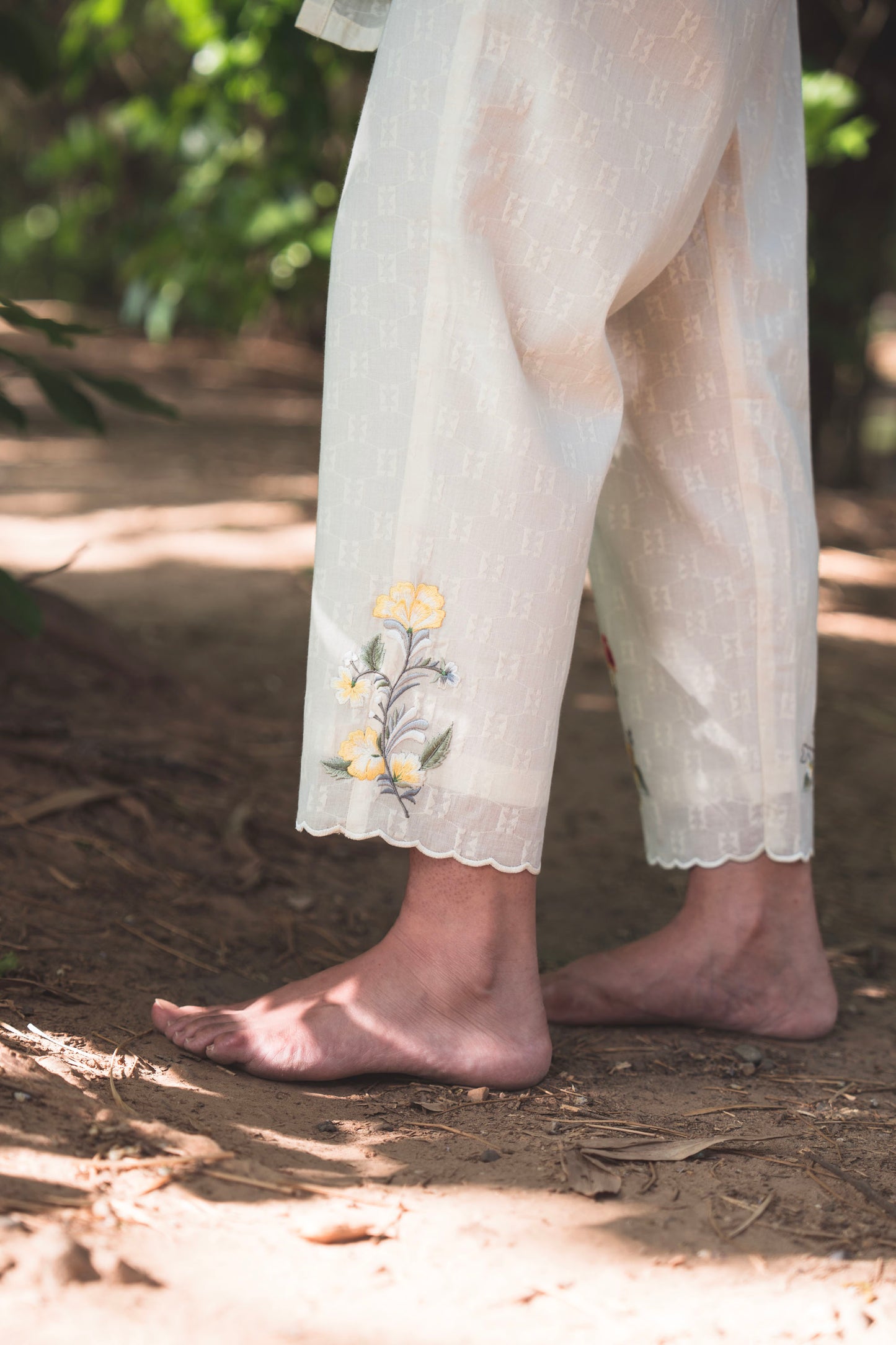 Cream Collared Kurta paired with Deer Embroidered Pants