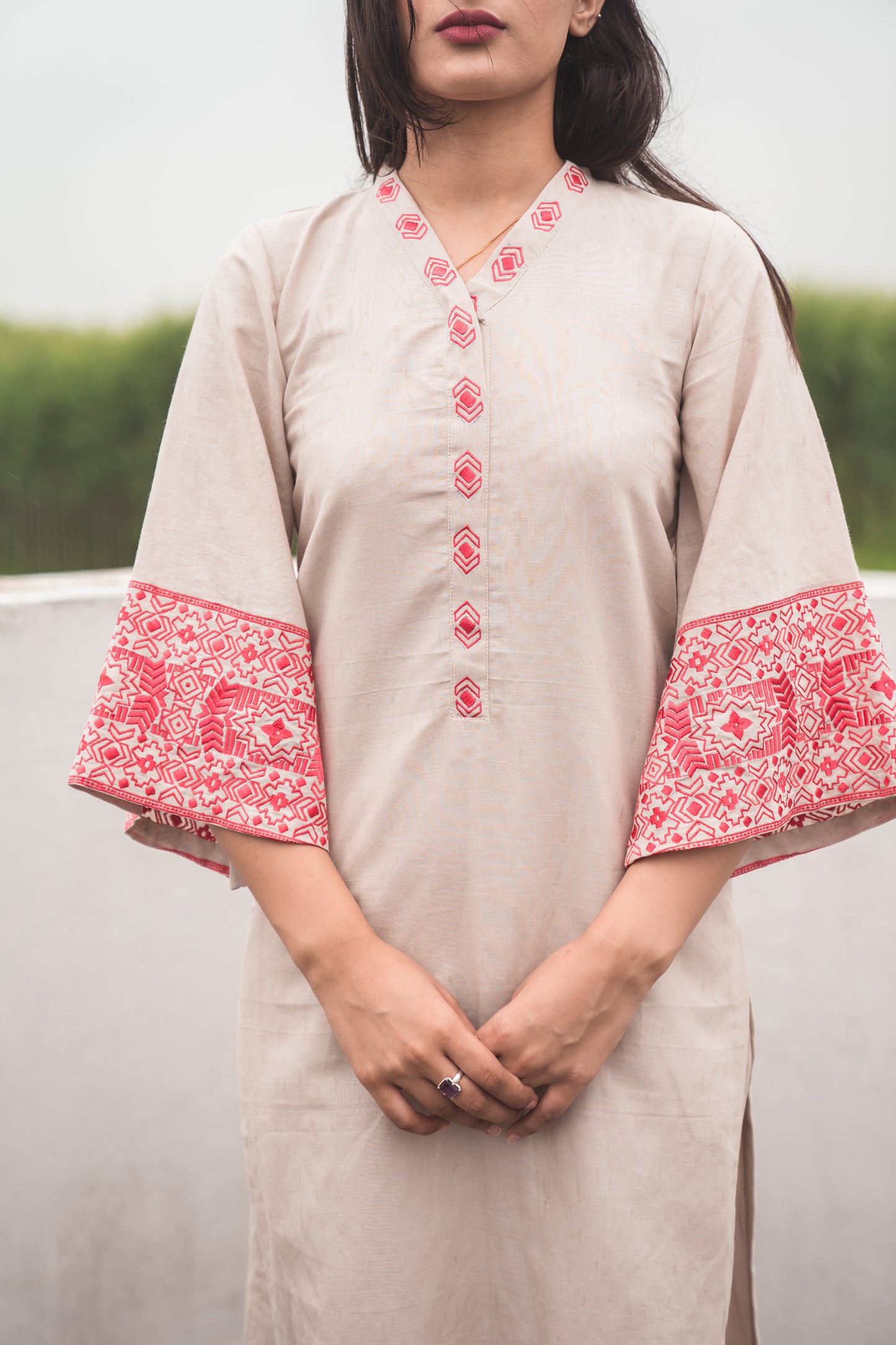Beige Kurta Set with Embroidered Sleeves in Coral