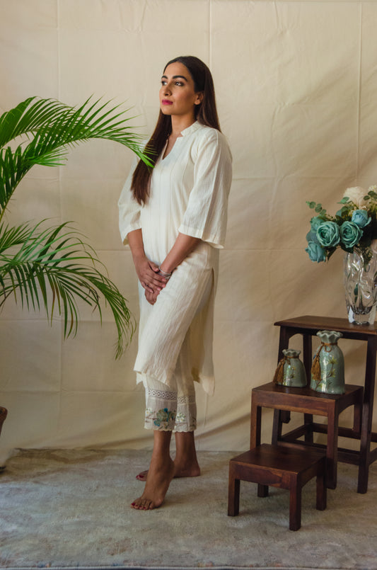 Cream Kurta Set paired with Blue Bird embroidered pants