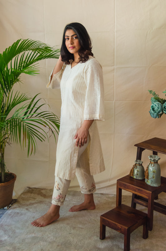 Cream Kurta Set paired with Brown Birds embroidered pants